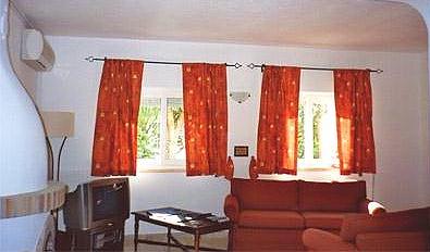 The living room of Casa Sandra complete with air conditioning and an in house entertainment system